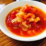 Minestrone Soup with onion, carrots, bell peppers, celery in it.
