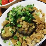 Miso stir-fry with eggplant and ground pork and sliced green onion on top.