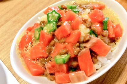 Mixed salmon, okura, natto, and chinese yam on top of white rice.