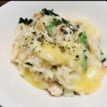 Rich risotto with salmon flakes on top